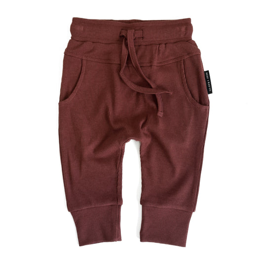 RED baby pants with a drawstring on a white background