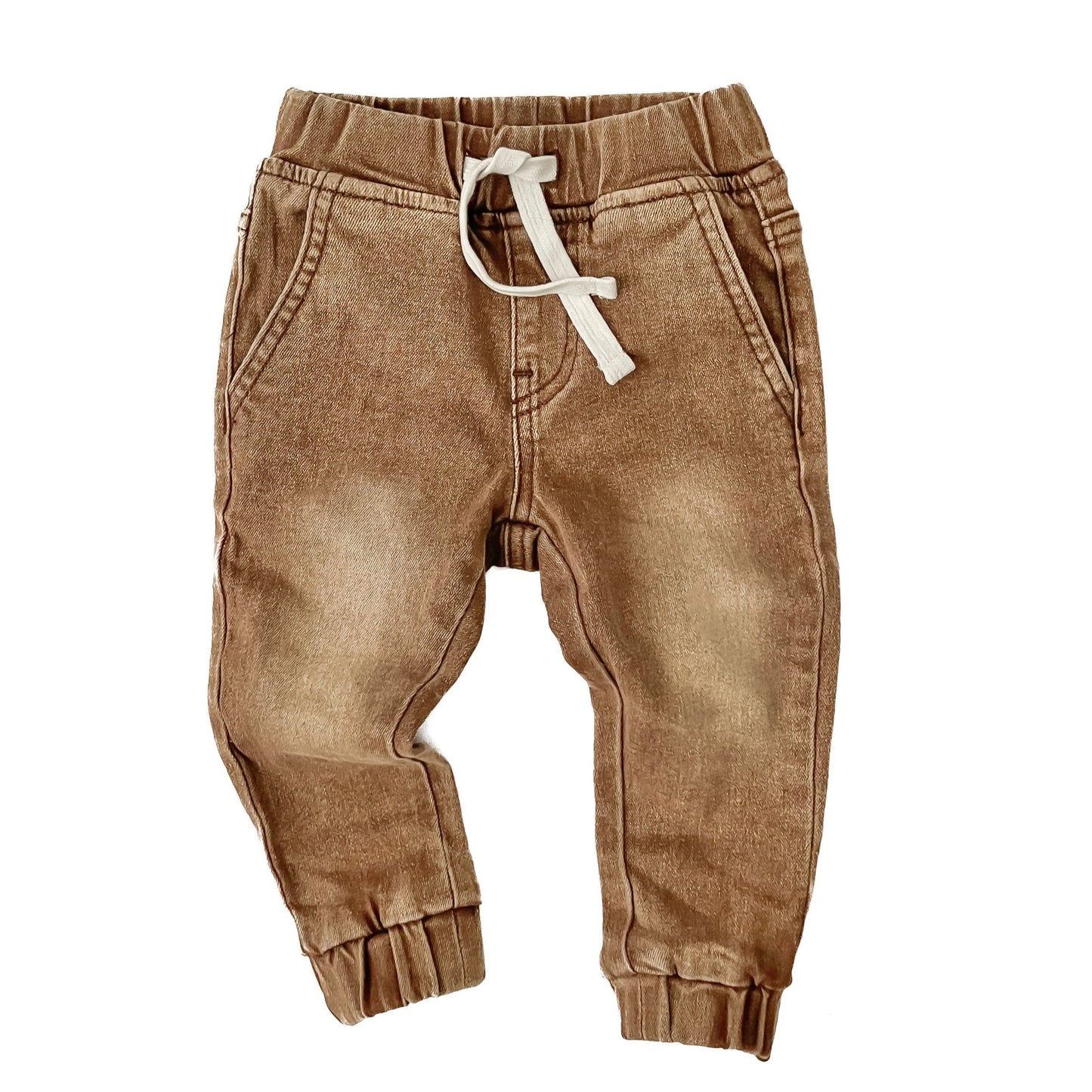 Brown children's pants with a white drawstring on a white background