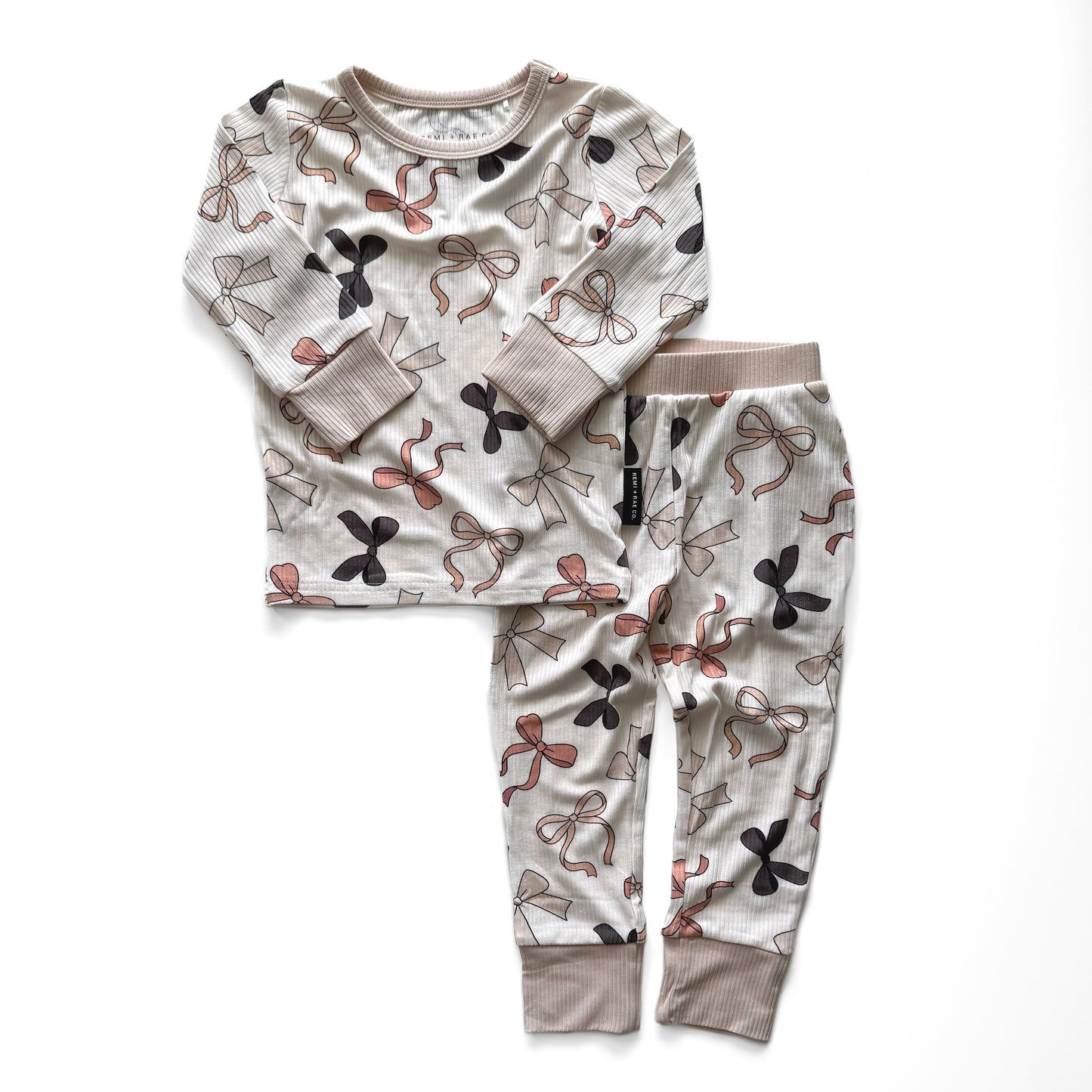 Children's pajama set with a bow design on a white background