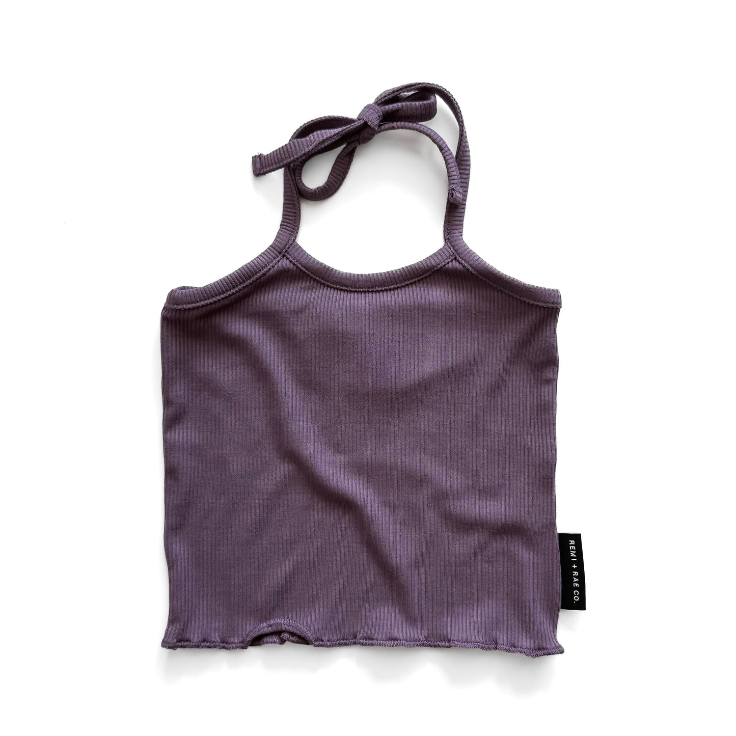 Purple tank top with thin straps on a white background