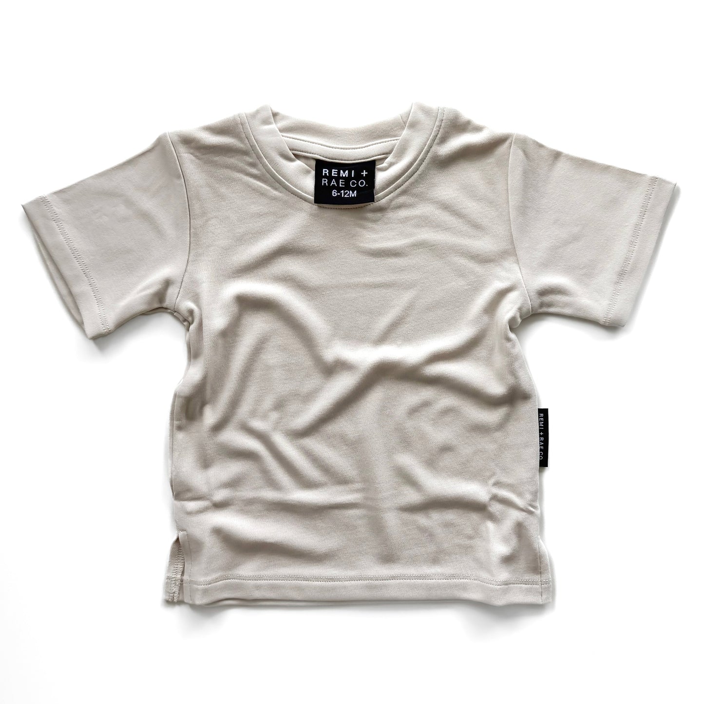 White t-shirt with brand label on a white background