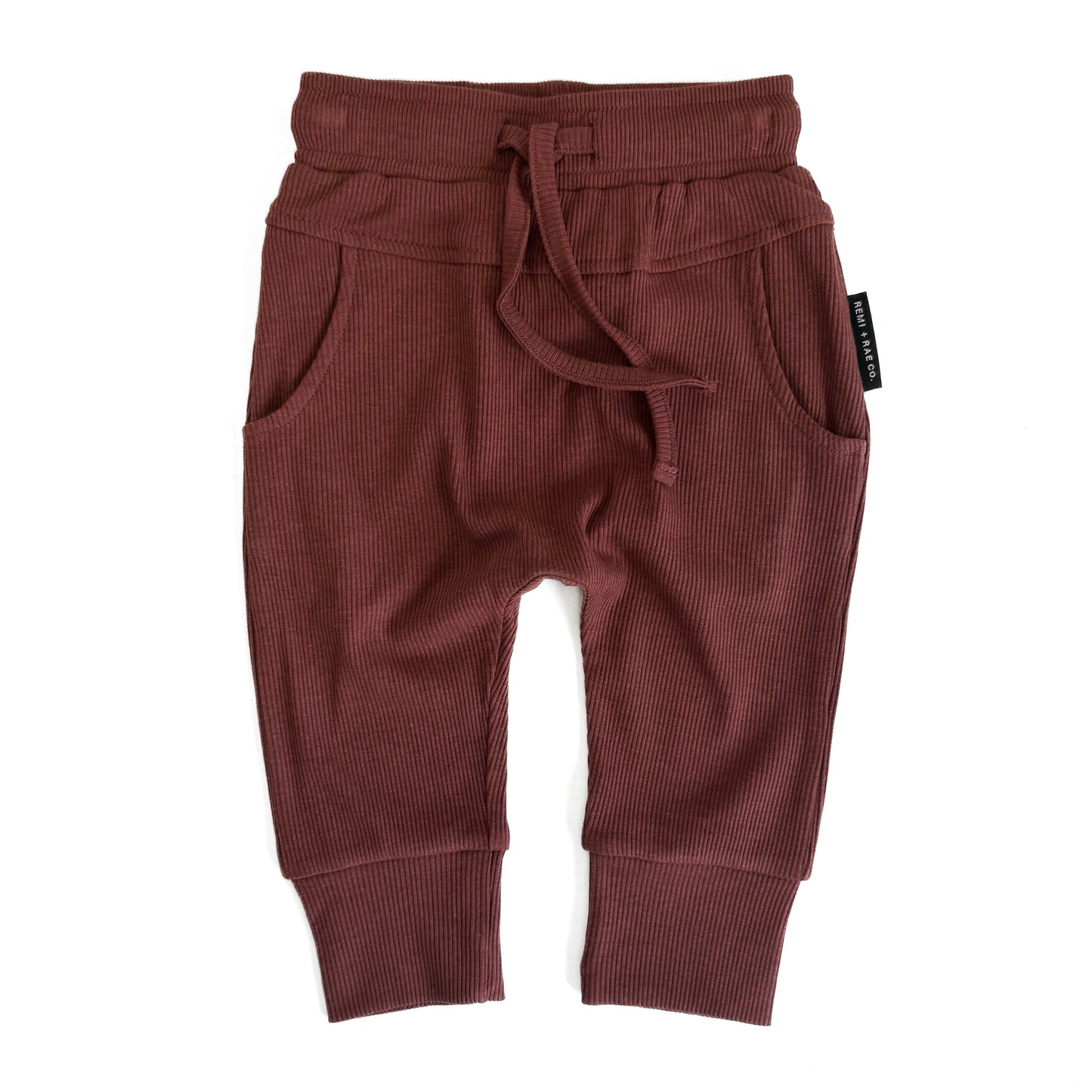 RED baby pants with a drawstring on a white background