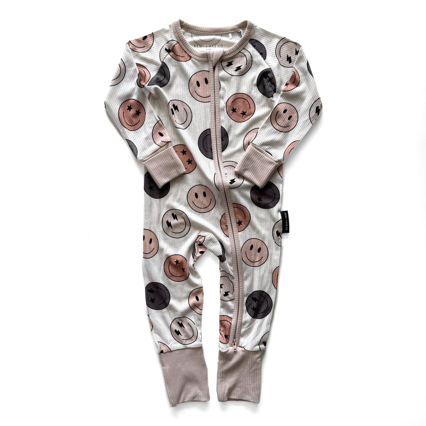 Baby onesie with smiley face pattern on a white background